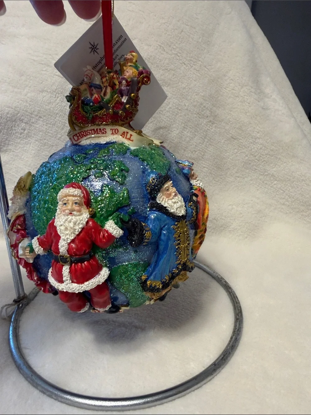 Christopher Radko Santa’s around the world with tag